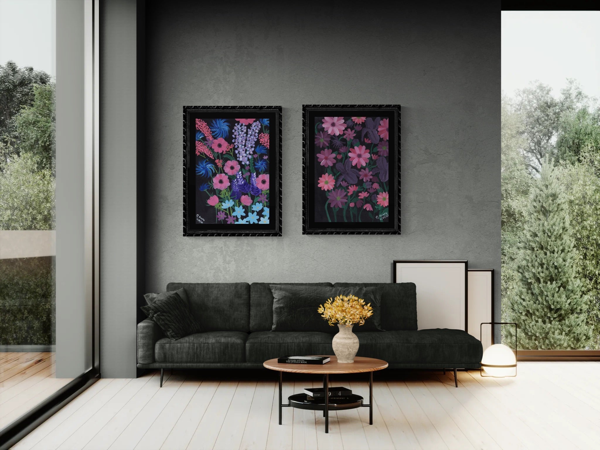 Pink Sapphire Designs' Midnight Blooms Art Print Collection (2 paintings of pink and purple flowers on black background in black frames) hanging on gray wall in living room with a gray sofa and coffee table.