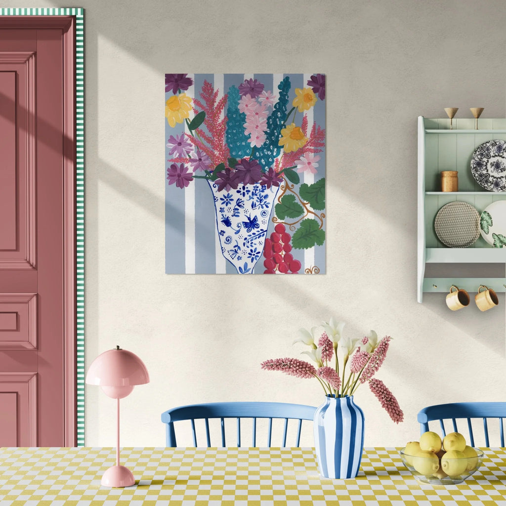 Colorful floral painting on a wall above a dining table with decorative elements.