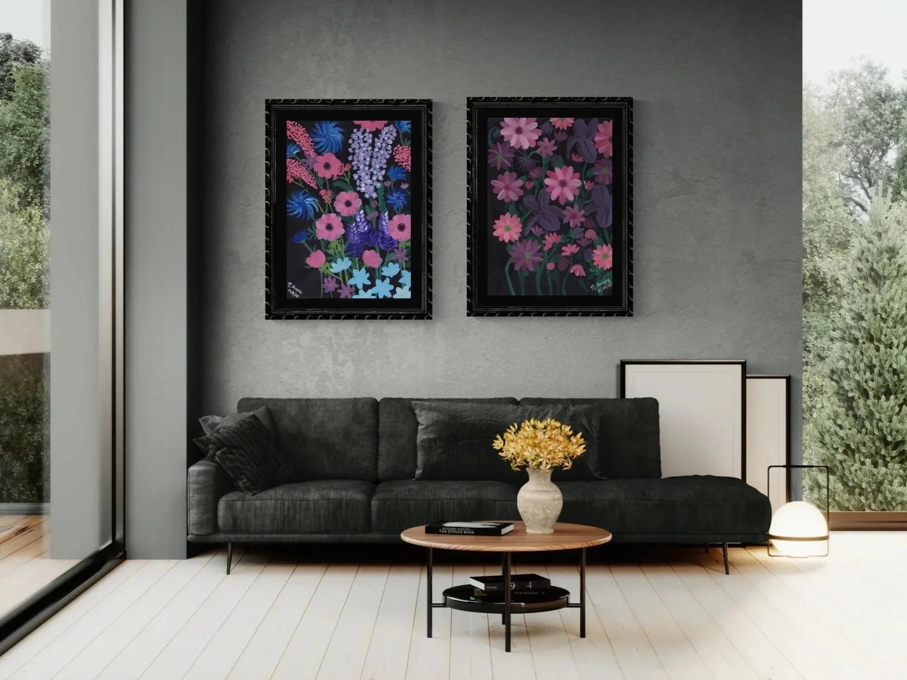 Modern living room with a gray sofa, round coffee table, and two moody floral artworks in purple, pink, and blue colors on the wall.