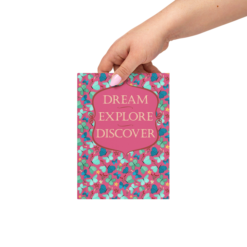 Red Dream, Explore, Discover butterfly hardcover journal shown in a styled lifestyle setting
