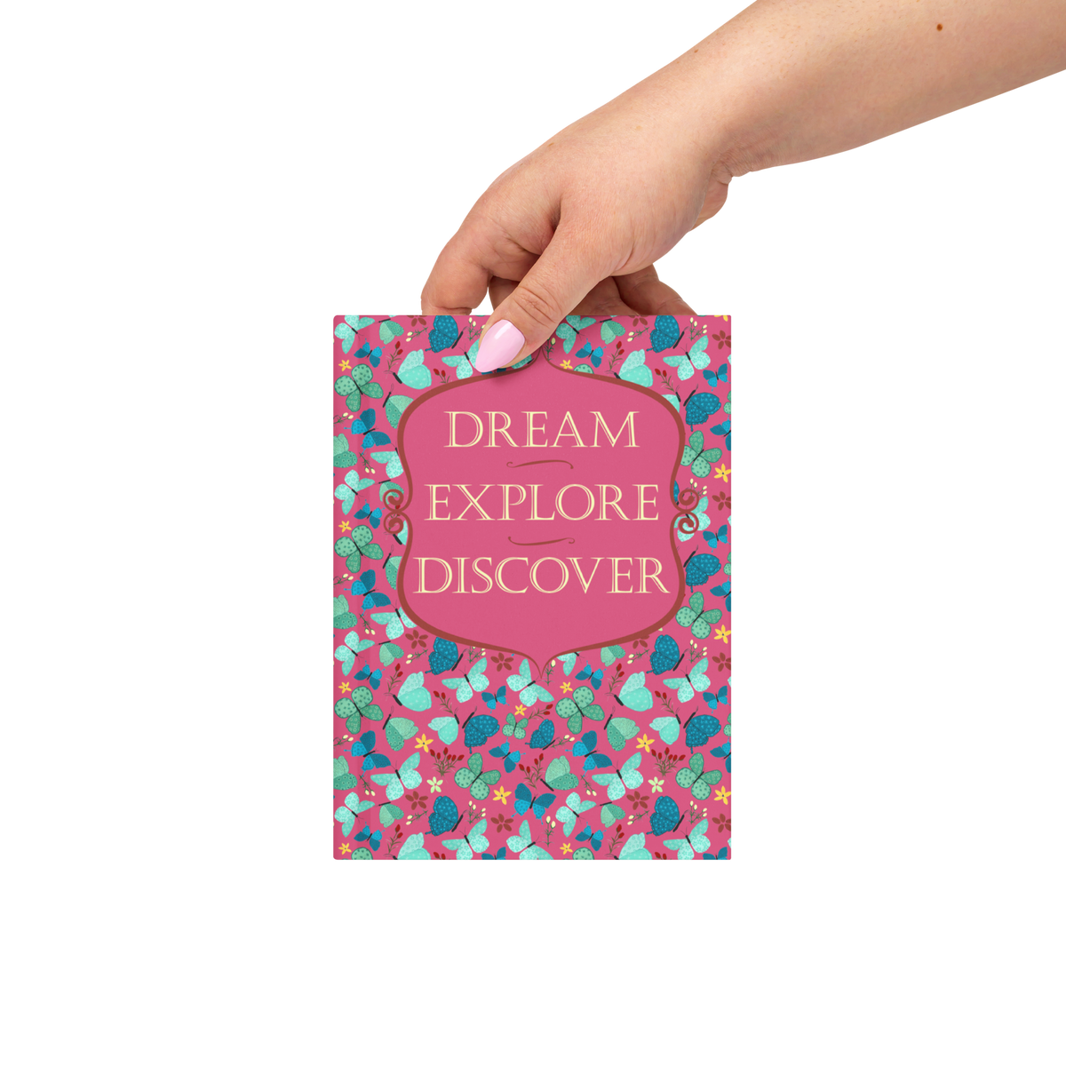 Red Dream, Explore, Discover butterfly hardcover journal shown in a styled lifestyle setting