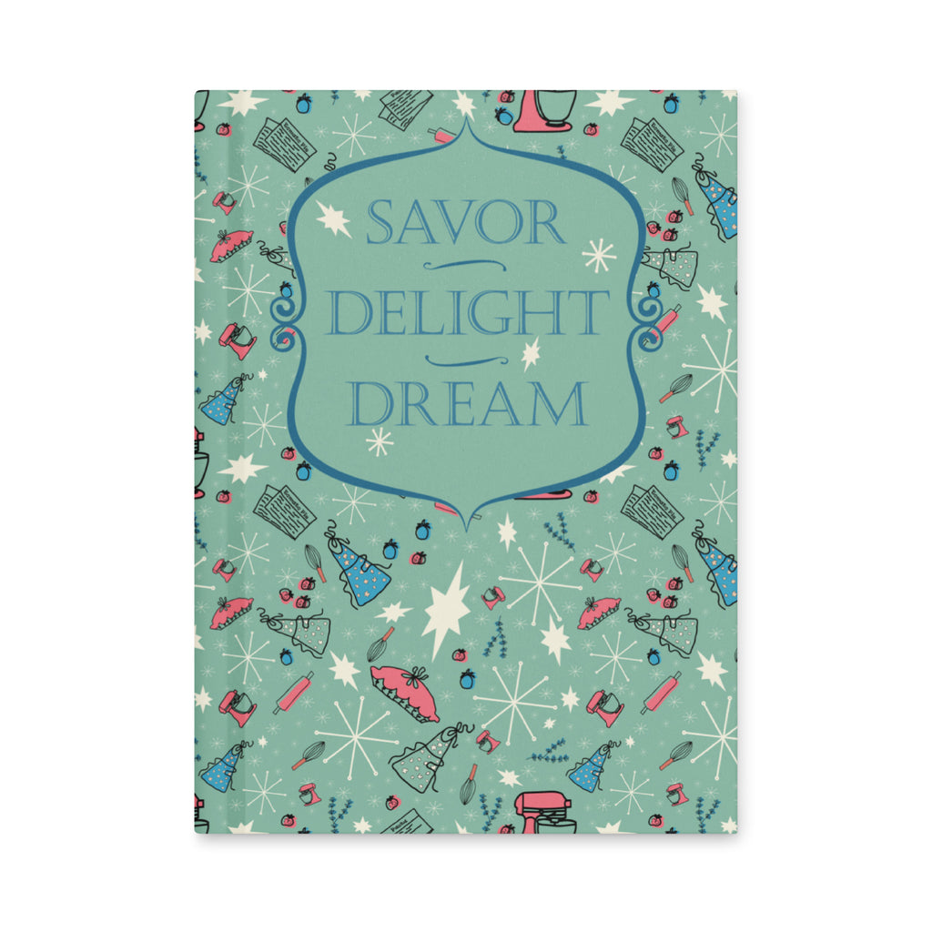 Front cover of the mint-green hardcover journal reading Savor, Delight, Dream
