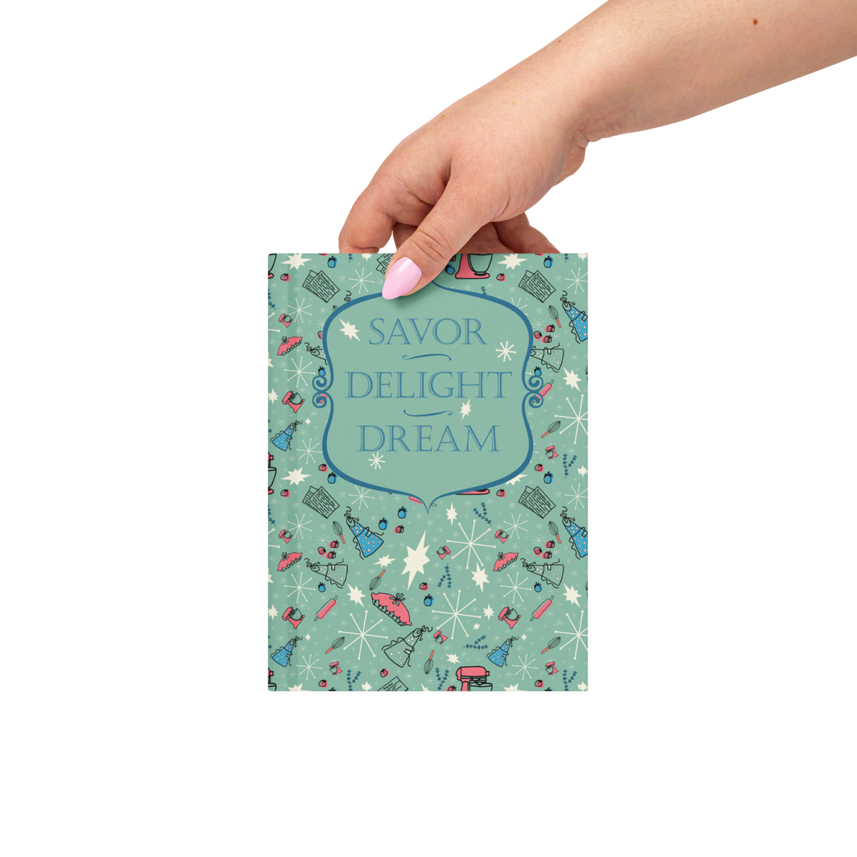 Woman's hand holding the mint-green Savor, Delight, Dream hardcover journal with the front cover facing forward