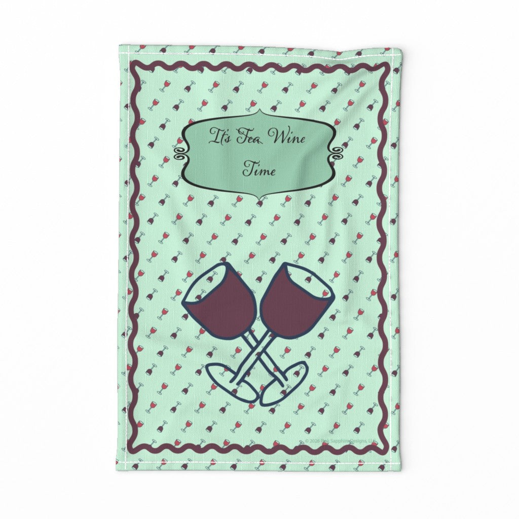 A rectangular kitchen towel with a light mint green background, featuring a repeating pattern of small red and dark brown wine glasses, a dark brown wavy border, a central label reading 'It's Tea Wine Time', with the word "Tea" crossed out.  At the bottom is two crossed wine glasses.
