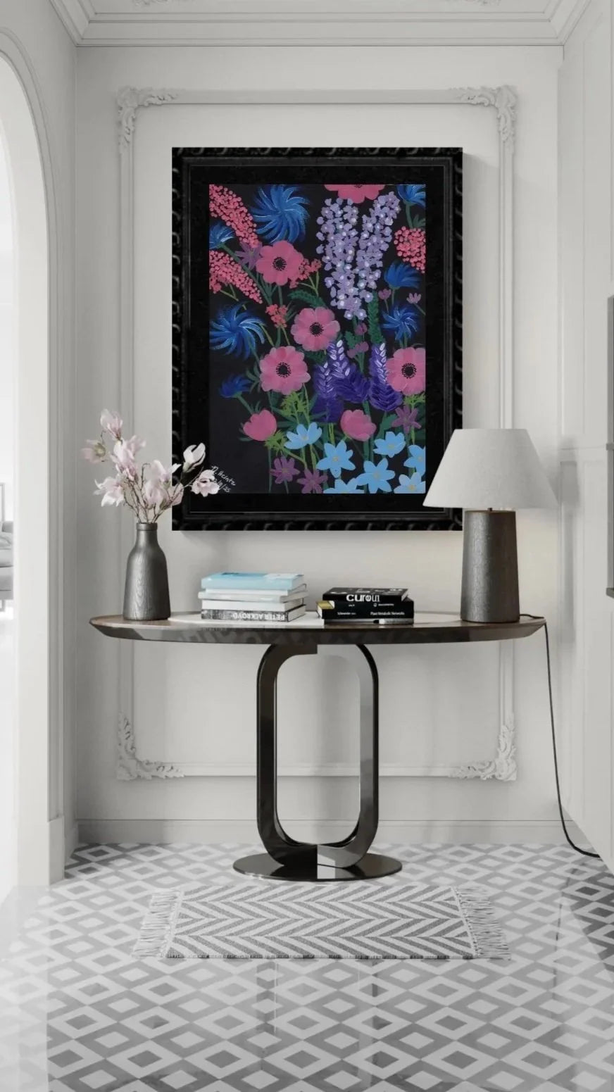Modern interior hallway with a console table, lamp, and pink, blue, purple, and black floral artwork on a gray wall.